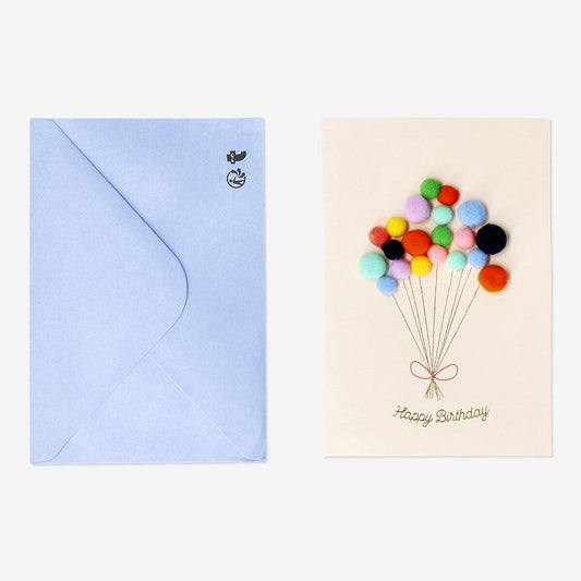Birthday card with pom pom balloons and envelope